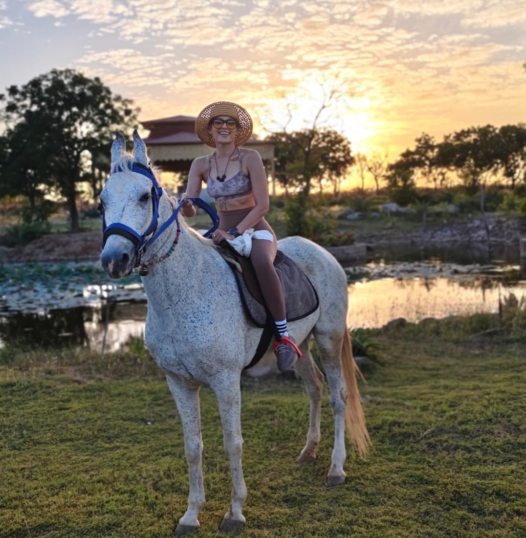 Naina at the farmhouse at sunset